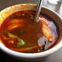 Tom Yum · Chicken, shrimp, tofu or vegetables, long hot and mushroom in spicy lemongrass soup. Spicy.