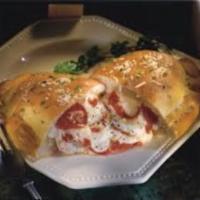 Calzone · Ricotta and mozzarella cheese with choice of up to 3 additional ingredients.