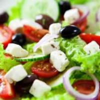 Greek Salad · Mixed greens, tomato, onion, Kalamata olives, pepperoncini peppers and crumbled feta cheese.