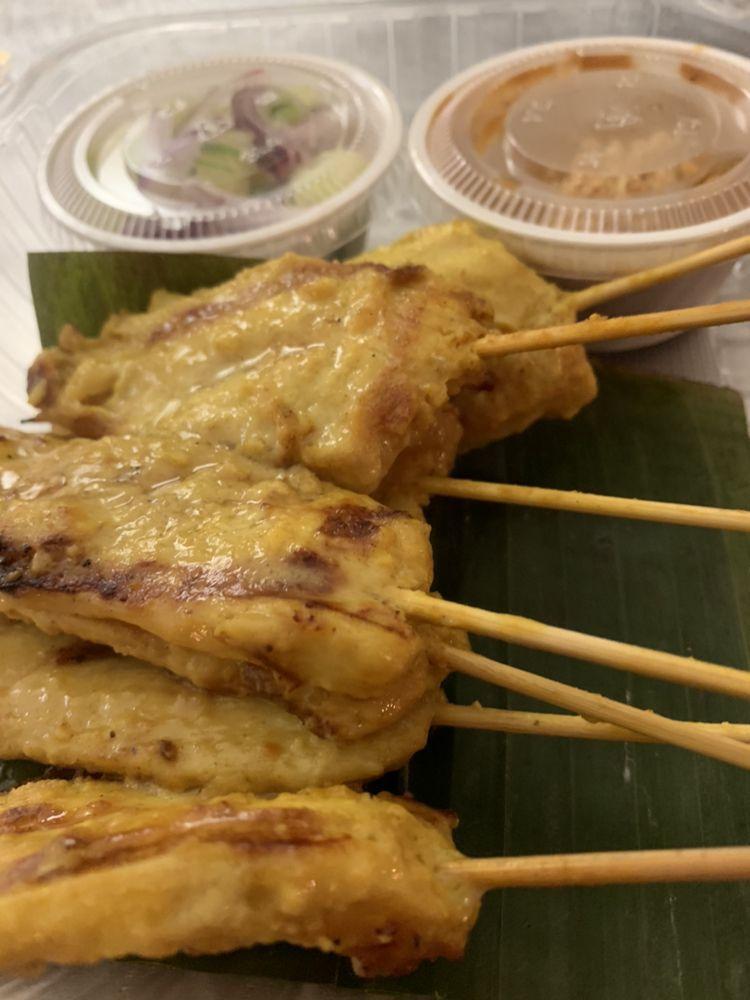 Chicken Satay · Grilled marinated chicken served with peanut sauce and cucumber salad.