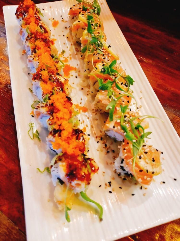 Lost at Lake Roll · Top: salmon, lemon slice, micro cilantro, and ponzu sauce. In: crab mix and cucumber.
