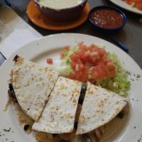 Veggie Quesadilla · Large flour tortilla filled with cheese, onions, bell peppers, mushrooms and tomatoes. Serve...