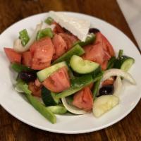 Greek Salad · Authentic Greek salad prepared with vine ripe tomatoes.