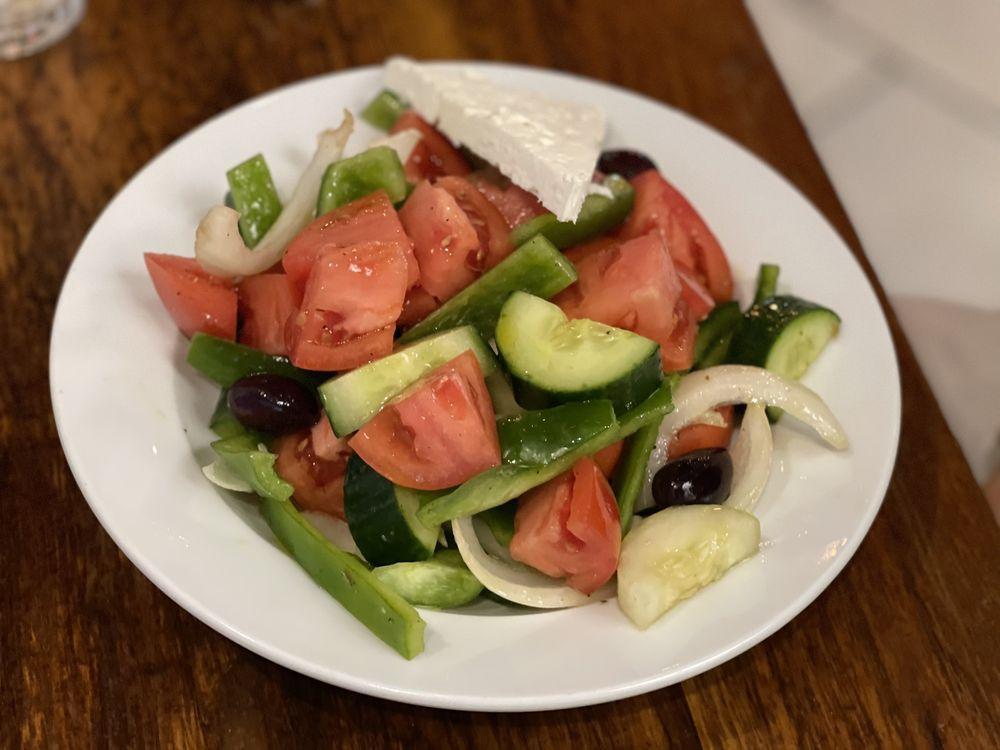 Greek Salad · Authentic Greek salad prepared with vine ripe tomatoes.