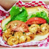 Fried Shrimp Po'boy Sandwich · This Po'boy is generously packed with succulent shrimp wrapped in our signature cornmeal-bas...
