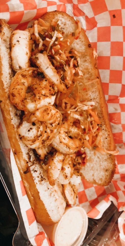 Grilled Shrimp Po'boy Sandwich · Calling all seafood lovers...the special blend of Cajun seasoning on these grilled shrimps really brings out its natural flavor while the toasted hoagie roll gives it that perfect crunch.