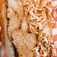 Fried Catfish Po'boy Sandwich · A catfish filet is dredged in our special cornmeal-based breading and then deep-fried to gol...