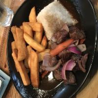 Lomo Saltado · Peruvian stir fry, made with beef, onions, tomatoes, cilantro, soy sauce and garlic all this...