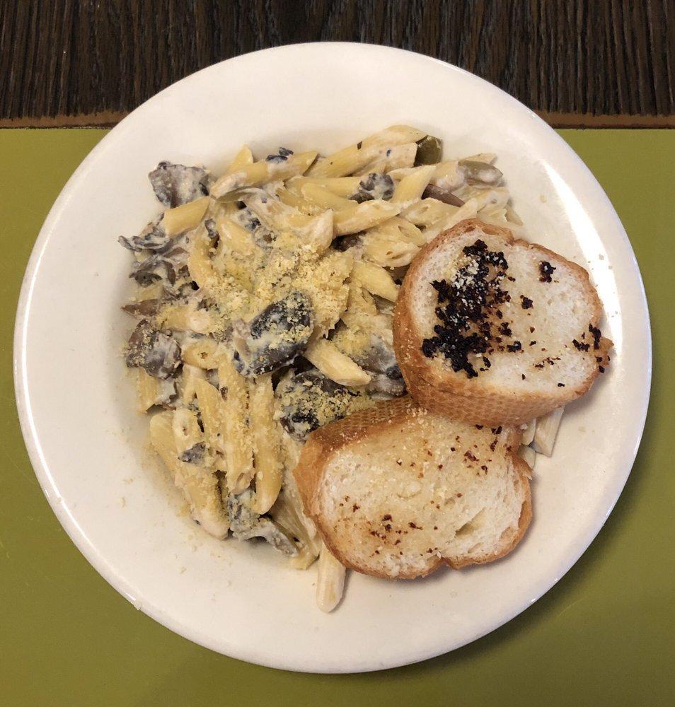 Mushroom Stroganoff · Penne pasta, button mushrooms, peppers, onions, sour cream, red wine, almond Parmesan, served with garlic bread, and a small salad (ranch, cilantro-lime or balsamic vinaigrette). Can be made gluten-free.