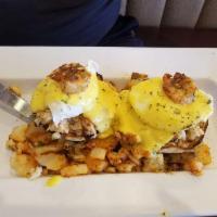 Eggs Benedict · English Muffin topped with Grilled Ham, Poached Eggs and Homemade Hollandaise Sauce.