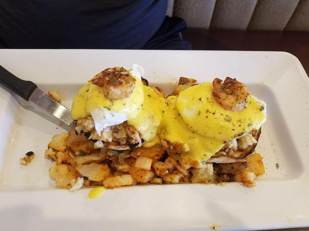Eggs Benedict · English Muffin topped with Grilled Ham, Poached Eggs and Homemade Hollandaise Sauce.