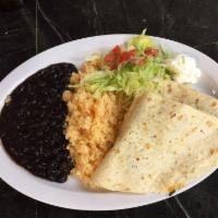 Quesadillas · Served with rice, beans, and sour cream on the side,  includes choices of chicken, steak, Me...