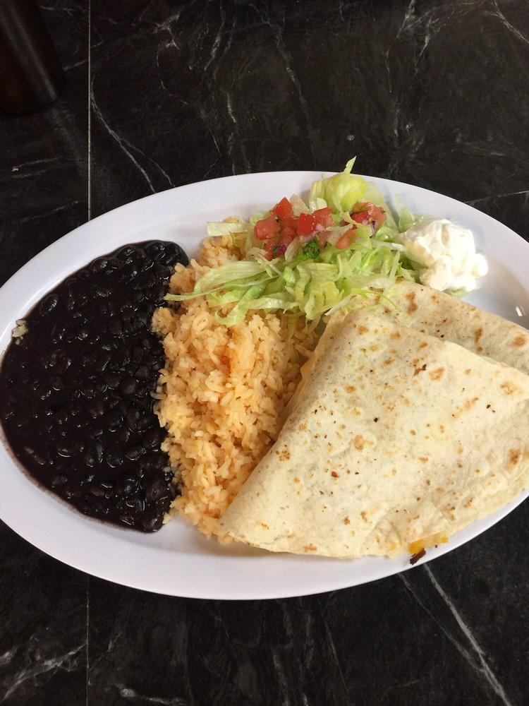 Quesadillas · Served with rice, beans, and sour cream on the side,  includes choices of chicken, steak, Mexican chorizo, marinated pork, cheese or vegetarian.