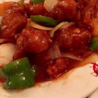 Sweet and Sour Chicken · Breaded white meat chicken sautéed with bell peppers, onions, and pineapple in a house-made ...