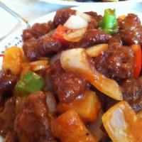 Sweet and Sour Pork · Battered deep-fried pork cooked with bell peppers, onions, and pineapple sautéed in Hunan sw...
