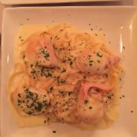 Chicken Cordon Bleu · Rolled with ham and Swiss cheese over fettuccine and Alfredo sauce.