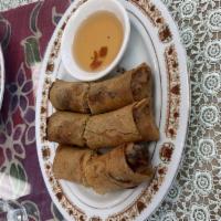 3 Chicken Spring Rolls · Crispy rolls filled with chicken, cabbage, onions, carrots, and glass noodles. Served with s...