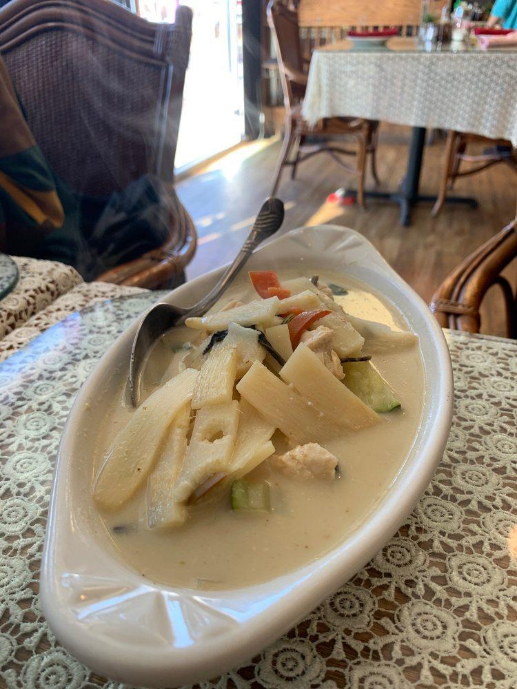 Green Curry · Served with choice of chicken, beef, or tofu in sweet and spicy coconut milk with bamboo shoots, bell peppers and basil leaves. Spicy.