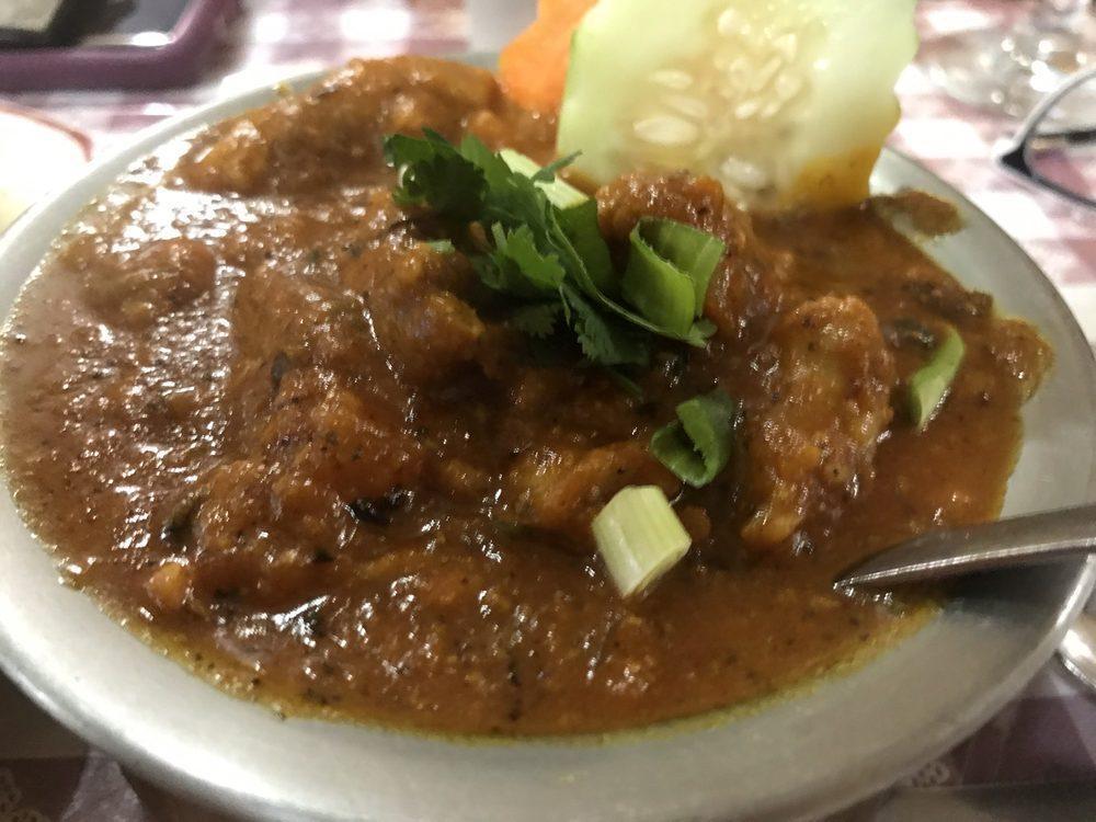 Chicken Curry · Traditional poultry dish prepared in a spicy curry sauce of ground onions, garlic, ginger, tomatoes, and seasonings. Served with rice.