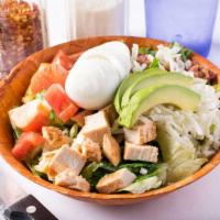 Cobb Salad · Romaine lettuce topped with chicken, tomatoes, bacon, cheese, boiled eggs, and avocados.