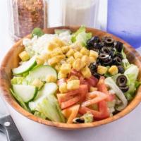 Greek Salad · Romaine lettuce topped with cucumbers, chopped tomatoes, olives, feta cheese, croutons, and ...