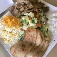Shawarma Combo Plate · Choice of chicken and beef or lamb, served with rice, salad and hummus.