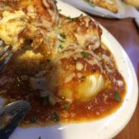 Stuffed Shells · Shells stuffed with our homemade seasoned ricotta and topped with marinara and mozzarella ch...