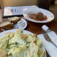 Caesar Salad · Crisp, fresh romaine lettuce mixed with creamy Caesar dressing and topped with croutons and ...