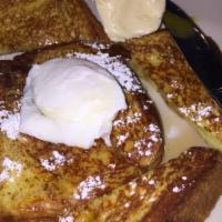 French Toast · 3 pieces. Served with butter and syrup.
