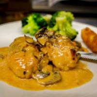 Stuffed Chicken · Stuffed with asparagus, mozzarella and prosciutto served in a creamy vodka sauce with mushro...