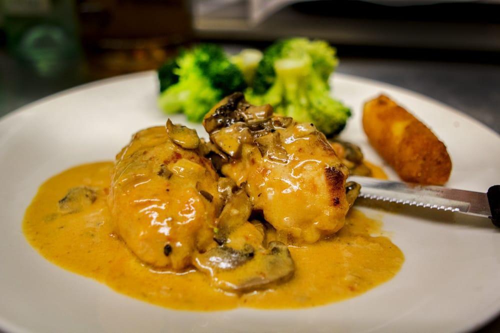 Stuffed Chicken · Stuffed with asparagus, mozzarella and prosciutto served in a creamy vodka sauce with mushrooms.