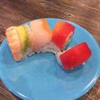 Rainbow Roll · Crab mix, avocado, cucumber, topped with salmon, tuna, shrimp, and white fish.