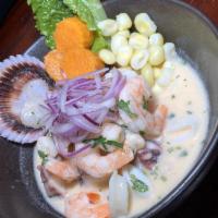 Ceviche Mixto · Fresh seafood mix marinated in lime juice with aji limo or rocoto, garlic, cilantro, and red...