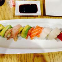 Rainbow Roll · California Roll topped with assorted fresh fish.
