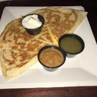 Quesadilla · cheddar, chihuahua, cheese, green onion, served with sour cream and guacamole