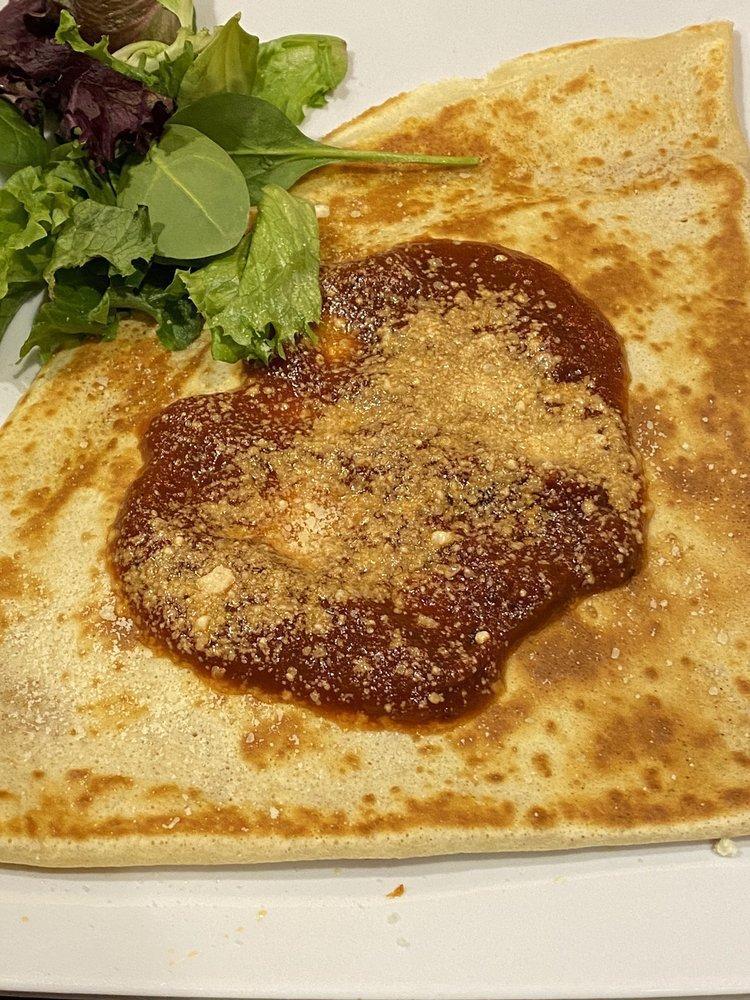 Pizza Crepe · Mozzarella cheese and pepperoni. Topped with tomato sauce and Parmesan cheese.
