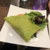 Veggie Crepe · Corn, black olives, lettuce. carrots, cilantro, and tomatoes. Topped with our own morron sau...
