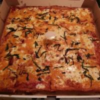 Drunk Grandma Pizza · Thin crust pan pizza, fresh mozzarella, vodka sauce and fresh basil.
