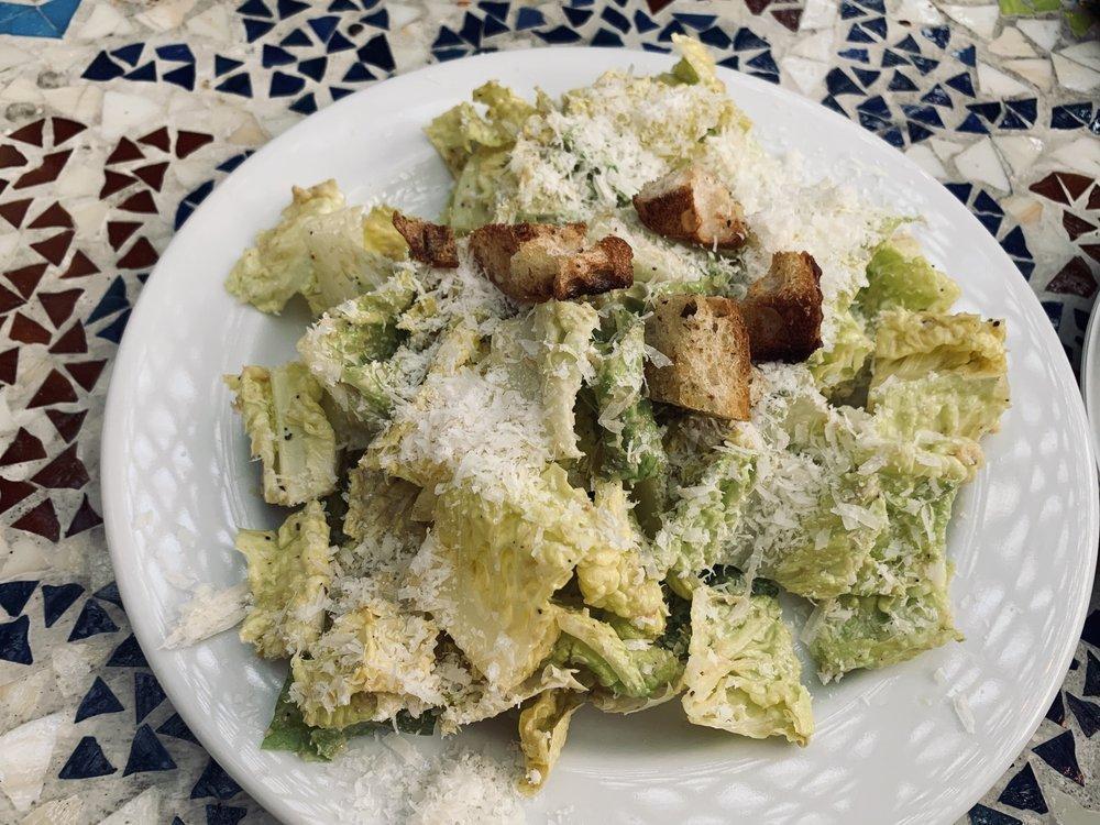 Classic Caesar Salad · Hearts of romaine, house-made Caesar dressing, house-made croutons and Parmesan cheese.
