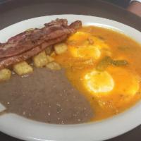 Huevos Rancheros · 2 large eggs over easy topped with a delicious ranchera sauce.