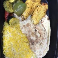 Chello Yek Combo · Your choice of 1 kabob and 1 side served with grilled veggies, Persian rice, and a piece of ...