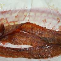 Candied Bacon · 3 piece applewood smoked bacon candied in a salty, smokey and savory flavor mixed with a pun...