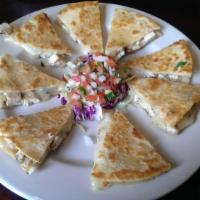 Quesadilla · Served with guacamole sour cream and jalapenos.