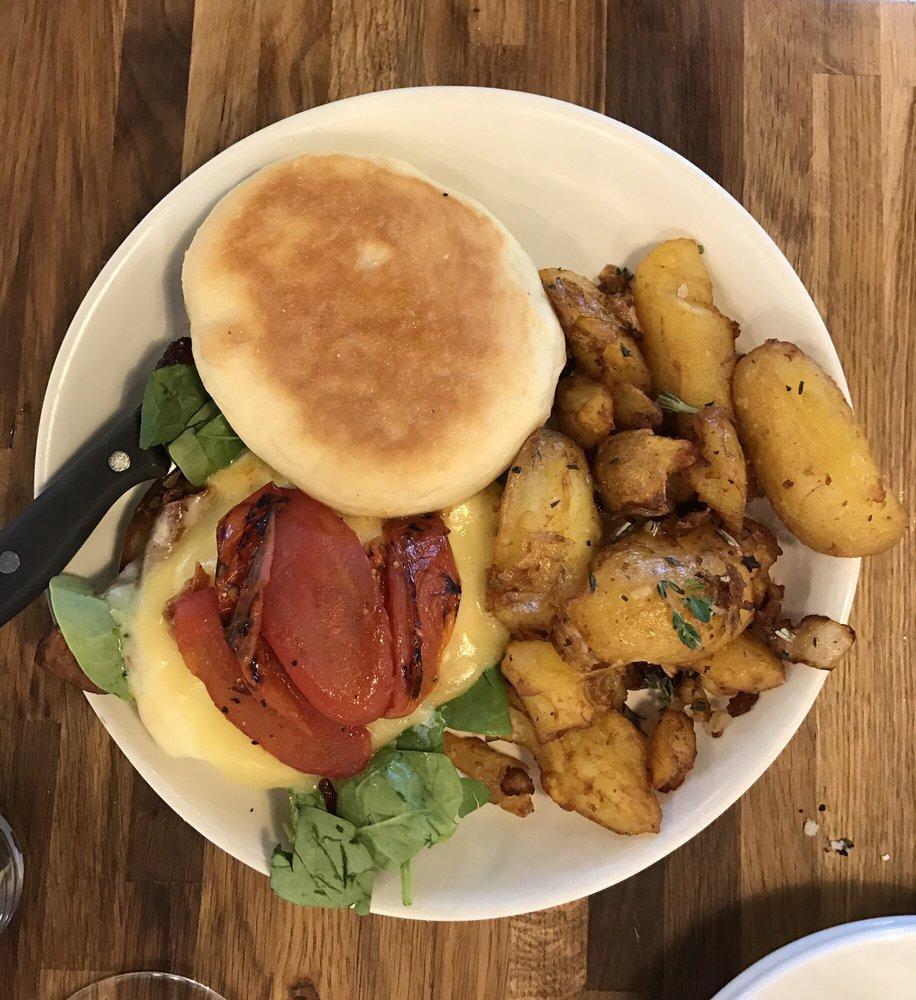 Prep's Breakfast Sammie · Our bacon, Muenster, and white cheddar, roasted tomatoes, spinach, scrambled egg, tomato aioli, English muffin, side of prep's potatoes.