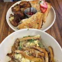Breakfast Poutine · pork belly, duck fat susage gravy, french fries, two over easy eggs, cheese curds