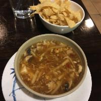 Hot & Sour Soup · Mushrooms, steamed tofu, bamboo shoots, and silky beaten eggs, simmered in a spicy house-mad...