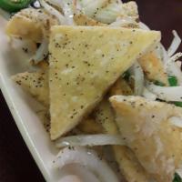 V6 - Salt and Pepper Tofu · Fried tofu sauteed and pan fried with jalapenos, and onions. Spicy. Served with a side of ri...
