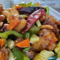 C5 - Kung Pao Chicken · Battered chicken, celery, carrots, bell peppers, long red peppers, squash, in a savory and s...