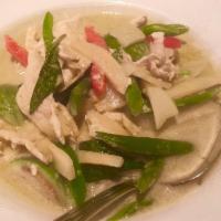 Green Curry · Spiciest of the curries, with bamboo shoots, Thai eggplant, green beans and basil leaves. Sp...