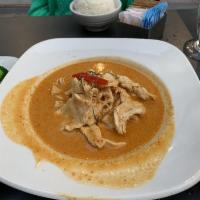 Panang Curry · A mild spiced curry blended with coconut milk and peanuts. Spicy.